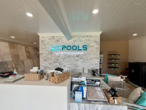 Inside the LIV Pools Largo showroom — finish samples and displays