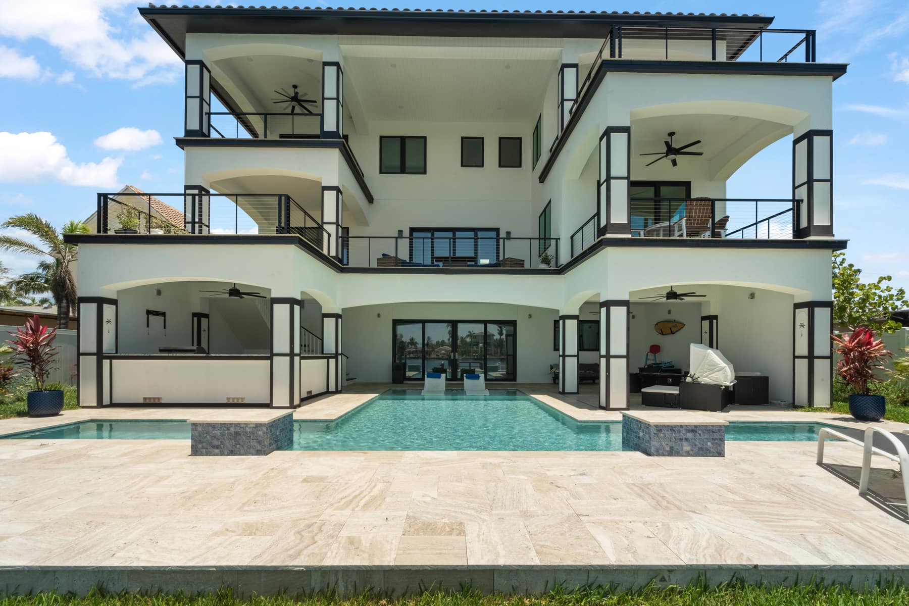 Custom panoramic pool screen enclosure with picture-window screen walls over a gunite pool and spa in Tampa Bay by LIV Pools